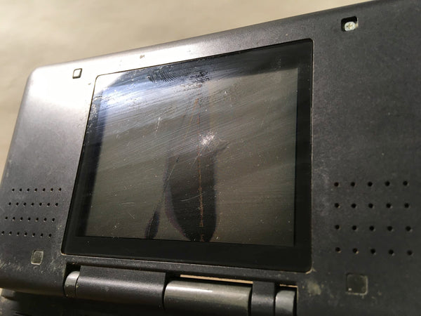 Nintendo DS Lite with white circular bezels on both screens
